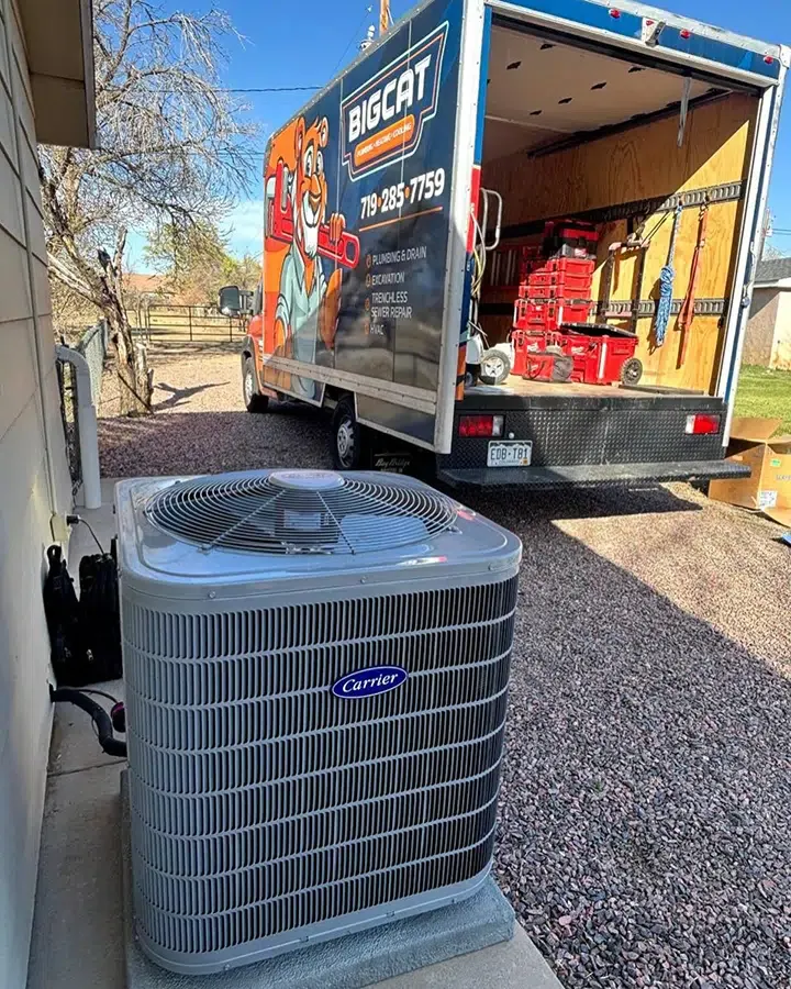 Big Cat truck with new Air Conditioner outside of residential home in Colorado Springs, CO.