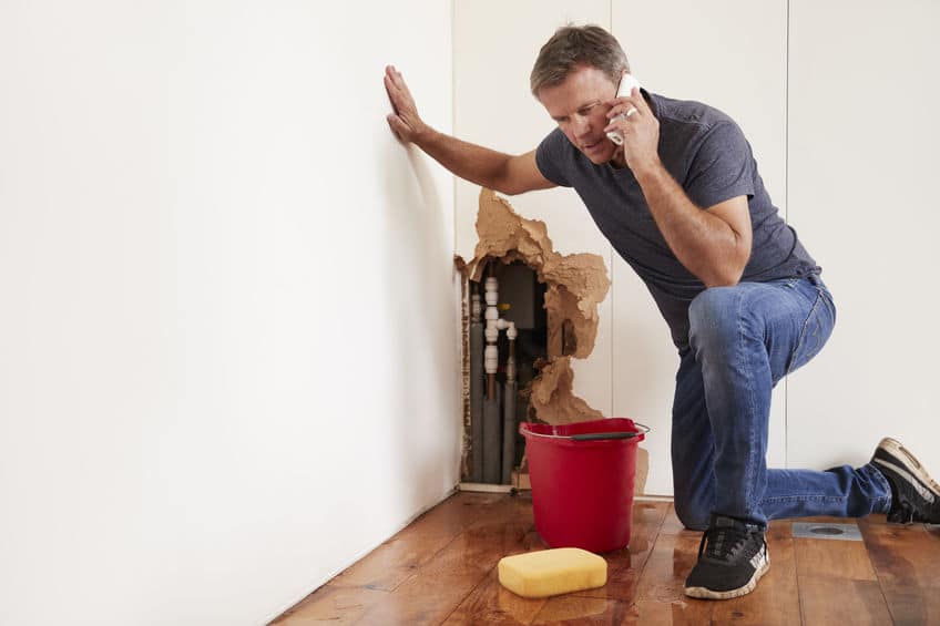 man calling an emergency plumber in pueblo