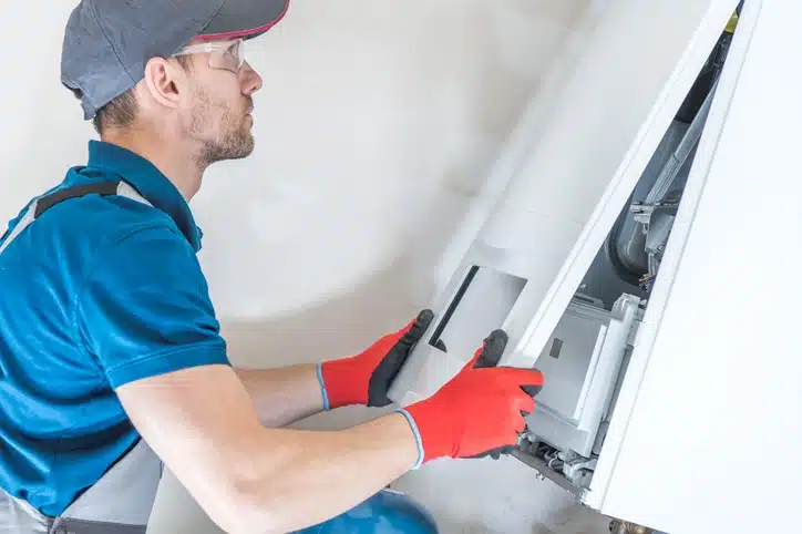 tech performing heater installation in Colorado Springs