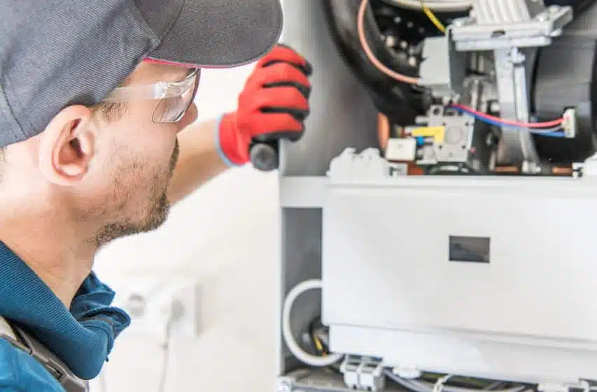 tech performing heating repair in Colorado Springs