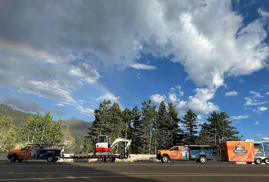 Big Cat Plumbing Heating & Cooling trucks with rainbow