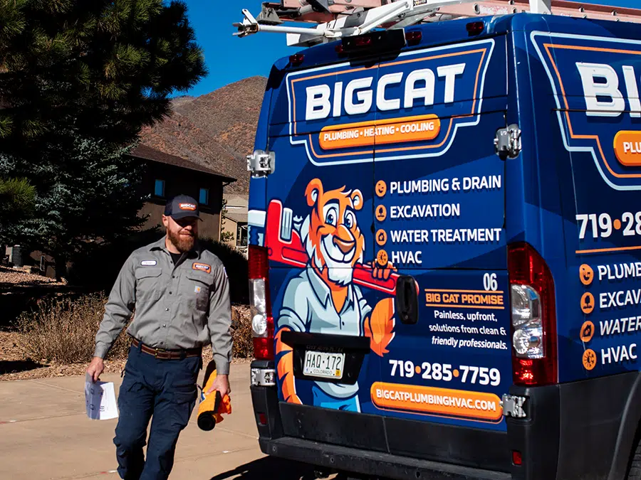 Big Cat Plumbing Heating and Cooling tech with truck
