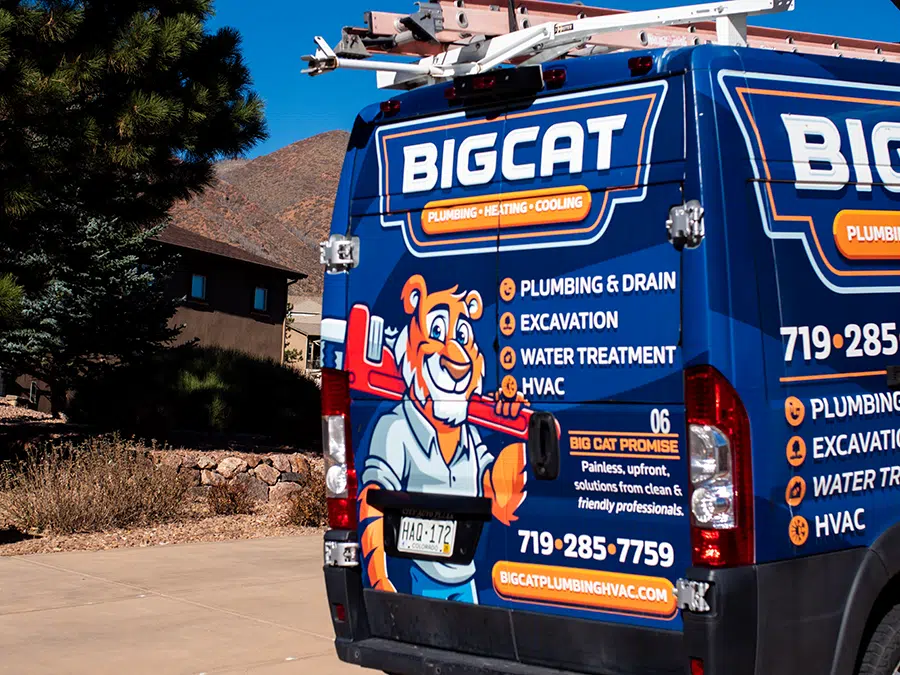 Big Cat plumbing heating & cooling truck in neighborhood